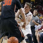 Arizona State's Bo Barnes, right, makes a bounce pass around the defense of Oregon State's Olaf Schaftenaar during the second half of an NCAA college basketball game, Wednesday, Jan. 28, 2015, in Tempe, Ariz. Arizona State defeated Oregon State 73-55. (AP Photo/Ralph Freso)
