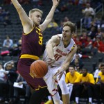 Maryland forward Jake Layman, right, passes the ball around Arizona State forward Jonathan Gilling, left, during the first half of the CBE Hall of Fame Classic college baseball game Monday, Nov. 24, 2014, in Kansas City, Mo. (AP Photo/Ed Zurga)