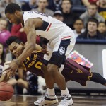Connecticut's Rodney Purvis, front, and Arizona State's Tra Holder, left, reach for a loose ball in the first half of an NCAA college basketball game in the first round of the NIT postseason tournament, March 18, 2015, in Storrs, Conn. (AP Photo/Jessica Hill)