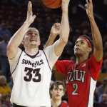 Arizona State's Bo Barnes (33) beats UNLV's Patrick McCaw (2) to the basket for a score during the second half of an NCAA college basketball game Wednesday, Dec. 3, 2014, in Tempe, Ariz. Arizona State defeated UNLV 77-55. (AP Photo/Ross D. Franklin)
