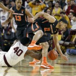 Oregon State's Malcolm Duvivier (11) and Arizona State's Shaquielle McKissic (40) reach for a loose ball during the first half of an NCAA college basketball game, Wednesday, Jan. 28, 2015, in Tempe, Ariz. (AP Photo/Ralph Freso)
