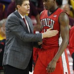UNLV head coach Dave Rice, left, talks with Dwayne Morgan, right, near the bench during the first half of a college basketball game against Arizona State Wednesday, Dec. 3, 2014, in Tempe, Ariz. (AP Photo/Ross D. Franklin)