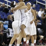 Florida State's Ivey Slaughter, right, and Brittany Brown, left, celebrate after a women's college basketball regional semifinal game against Arizona State in the NCAA Tournament, Saturday, March 28, 2015, in Greensboro, N.C. Florida State won 66-65. (AP Photo/Chuck Burton)