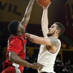 Arizona State's Eric Jacobsen, right, gets a shot off over UNLV's Goodluck Okonoboh, left, during the second half of an NCAA college basketball game Wednesday, Dec. 3, 2014, in Tempe, Ariz. Arizona State defeated UNLV 77-55. (AP Photo/Ross D. Franklin)