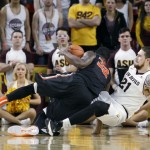 Oregon State forward Jarmal Reid (32) and Arizona State's Eric Jacobsen fall to the court after colliding during the second half of an NCAA college basketball game, Wednesday, Jan. 28, 2015, in Tempe, Ariz. Arizona State defeated Oregon State 73-55. (AP Photo/Ralph Freso)
