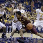 Arizona State's Tra Holder (0) drives the ball against California's David Kravish (45), Dwight Tarwater and Tyrone Wallace (3) during the first half of an NCAA college basketball game Thursday, Jan. 22, 2015, in Berkeley, Calif. (AP Photo/Ben Margot)