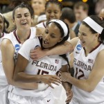 Florida State players, from left, Leticia Romero, Maegan Conwright, and Brittany Brown celebrate after a women's college basketball regional semifinal game against Arizona State in the NCAA Tournament, Saturday, March 28, 2015, in Greensboro, N.C. Florida State won 66-65. (AP Photo/Chuck Burton)
