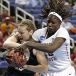 Florida State's Shakayla Thomas, right, and Arizona State's Sophie Brunner, left, battle for a rebound in the second half of a women's college basketball regional semifinal game in the NCAA Tournament in Greensboro, N.C., Friday, March 27, 2015. Florida State won 66-65. (AP Photo/Chuck Burton)