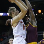 Maryland forward Jake Layman, left, takes a shot against Arizona State forward Willie Atwood, right, in the first half of the CBE Hall of Fame Classic college baseball game Monday, Nov. 24, 2014, in Kansas City, Mo. (AP Photo/Ed Zurga)