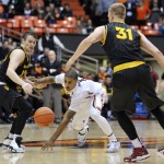  Oregon State's Gary Payton II, middle, vies for the ball against Arizona State's Jonathan Gilling (31) and Bo Barnes (33) during the second half of an NCAA college basketball game in Corvallis, Ore., Thursday Jan. 8, 2015. Oregon State won 55-47. (AP Photo/Greg Wahl-Stephens)