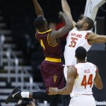 Arizona State guard Gerry Blakes (4) takes a shot over Maryland forward Damonte Dodd (35) as Dez Wells (44) looks on in the first half of the CBE Hall of Fame Classic college baseball game Monday, Nov. 24, 2014, in Kansas City, Mo. (AP Photo/Ed Zurga)