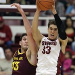 Stanford forward Dwight Powell, right, grabs the rebound as Arizona State center Jordan Bachynski, left, looks on during the first half of their NCAA college basketball game Saturday, Feb. 1, 2014, in Stanford, Calif. (AP Photo/Eric Risberg)