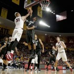 Arizona State's Jonathan Gilling (31) tries to get off a shot as Colorado's Xavier Talton (3) defends while Arizona State's Jordan Bachynski (13) and Colorado's Jaron Hopkins (23), Josh Scott, third from right, Eli Stalzer, second from left, and Xavier Johnson, left, watch during the second half of an NCAA college basketball game Saturday, Jan. 25, 2014, in Tempe, Ariz. Arizona State defeated Colorado 72-51. (AP Photo/Ross D. Franklin)