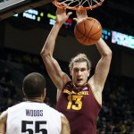 Arizona State's Jordan Bachynski, right, slams a dunk against Oregon's Tony Woods, left, during the first half of an NCAA college basketball game in Eugene, Ore. Sunday Jan. 13, 2013. (AP Photo/Chris Pietsch)