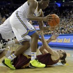 UCLA guard Jordan Adams (3) collides with Arizona State center Jorday Bachynski (13) in the first half of an NCAA college basketball game in Los Angeles Wednesday, Feb. 27, 2013. (AP Photo/Reed Saxon)