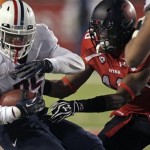 Arizona running back Ka'Deem Carey (25) carries the ball as Utah defensive back Eric Rowe (18) attempts to make the tackle in the first quarter during an NCAA college football game on Saturday, Nov. 17, 2012, in Salt Lake City. (AP Photo/Rick Bowmer)
