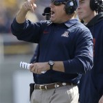 Arizona head coach Rich Rodriguez gestures from the sideline during the first quarter of an NCAA college football game against California in Berkeley, Calif., Saturday, Nov. 2, 2013. (AP Photo/Jeff Chiu)