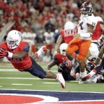 Arizona's Ka'Deem Carey (25) dives into the endzone for a touchdown against Texas San Antonio but was cancelled due to a backfield penalty during the fourth quarter of an NCAA Football game in Tucson, Ariz. on Sat. Sept. 14, 2013. (AP Photo/Wily Low)