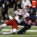 Utah's Dres Anderson (6) is tackled by Arizona's Jonathan McKnight in the first half of an NCAA college football game, Saturday, Oct. 19, 2013, in Tucson, Ariz. (AP Photo/Wily Low)
