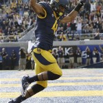 California wide receiver Kenny Lawler (4) celebrates after scoring on a 17-yard touchdown reception from quarterback Jared Goff during the second quarter of an NCAA college football game against Arizona in Berkeley, Calif., Saturday, Nov. 2, 2013. (AP Photo/Jeff Chiu)