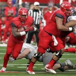  Arizona's Ka'Deem Carey (25) runs around the right side against Oregon for a short gain in the first half of an NCAA college football game on Saturday, Nov. 23, 2013, in Tucson, Ariz. (AP Photo/John MIller)