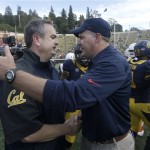 California head coach Sonny Dykes, left, greets Arizona head coach Rich Rodriguez after an NCAA college football game in Berkeley, Calif., Saturday, Nov. 2, 2013. Arizona won 33-28. (AP Photo/Jeff Chiu)
