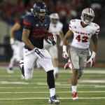 Arizona running back Austin Hill (29) scores a touchdown against UNLV during the second half of an NCAA college football game, Friday, Aug. 29, 2014, in Tucson, Ariz. (AP Photo/Rick Scuteri)
