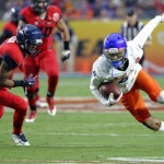 Boise State wide receiver Chaz Anderson, right, scrambles for extra yards after the catch as Arizona cornerback Cam Denson (3) defends during the first half of the Fiesta Bowl NCAA college football game, Wednesday, Dec. 31, 2014, in Glendale, Ariz. (AP Photo/Ross D. Franklin)