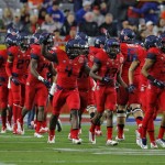 Arizona players take the field prior to the Fiesta Bowl NCAA college football game against Boise State, Wednesday, Dec. 31, 2014, in Glendale, Ariz. (AP Photo/Rick Scuteri)
