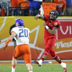 Arizona quarterback Anu Solomon (12) throws over Boise State linebacker Tanner Vallejo (20) during the first half of the Fiesta Bowl NCAA college football game, Wednesday, Dec. 31, 2014, in Glendale, Ariz. (AP Photo/Ross D. Franklin)