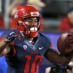 Arizona receiver Samajie Grant celebrates after scoring a touchdown against Colorado during the second half of an NCAA college football game, Saturday, Nov. 8, 2014, in Tucson, Ariz. (AP Photo/Rick Scuteri)