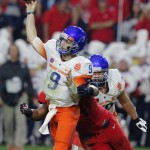 Boise State quarterback Grant Hedrick (9) throws against Arizona during the first half of the Fiesta Bowl NCAA college football game, Wednesday, Dec. 31, 2014, in Glendale, Ariz. (AP Photo/Rick Scuteri)