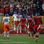Boise State wide receiver Chaz Anderson (6) celebrates his touchdown catch with teammate Troy Ware (14) during the first half of the Fiesta Bowl NCAA college football game against Arizona, Wednesday, Dec. 31, 2014, in Glendale, Ariz. (AP Photo/Ross D. Franklin)