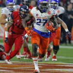 Boise State running back Jay Ajayi (27) breaks free for a touchdown run against Arizona during the first half of the Fiesta Bowl NCAA college football game, Wednesday, Dec. 31, 2014, in Glendale, Ariz. (AP Photo/Rick Scuteri)