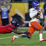 Boise State wide receiver Chaz Anderson (6) pulls in a touchdown pass as Arizona cornerback Jarvis McCall Jr. defends during the first half of the Fiesta Bowl NCAA college football game, Wednesday, Dec. 31, 2014, in Glendale, Ariz. (AP Photo/Rick Scuteri)