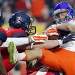 Boise State wide receiver Thomas Sperbeck (82) is stopped during the first half of the Fiesta Bowl NCAA college football game against Arizona, Wednesday, Dec. 31, 2014, in Glendale, Ariz. (AP Photo/Rick Scuteri)