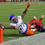 Boise State running back Jay Ajayi dives for the touchdown as Arizona cornerback Jarvis McCall Jr. defends during the first half of the Fiesta Bowl NCAA college football game, Wednesday, Dec. 31, 2014, in Glendale, Ariz. (AP Photo/Rick Scuteri)