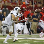 Nevada wide receiver Richy Turner (2) makes the catch in front of Arizona safety William Parks (11) during the first half of the NCAA college football game, Saturday, Sept. 13, 2014, in Tucson, Ariz. (AP Photo/Rick Scuteri)
