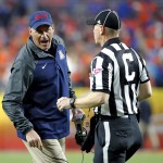Arizona head coach Rich Rodriguez yells to the referee during the first half of the Fiesta Bowl NCAA college football game against Boise State, Wednesday, Dec. 31, 2014, in Glendale, Ariz. (AP Photo/Ross D. Franklin)