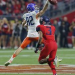 Boise State wide receiver Thomas Sperbeck (82) misses the catch as Arizona cornerback Cam Denson (3) runs up for the interception during the first half of the Fiesta Bowl NCAA college football game, Wednesday, Dec. 31, 2014, in Glendale, Ariz. (AP Photo/Rick Scuteri)