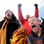 Boston fans Cole Nelson, right, and Anne Nelson cheer during the AdvoCare V100 Bowl Tuesday afternoon, Dec. 31, 2013, in Shreveport, La. Arizona played Boston College in the NCAA college football bowl game.(AP Photo/The Shreveport Times, Henrietta Wildsmith )