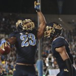 UCLA running back Johnathan Franklin (23) celebrates with wide receiver Shaquelle Evans after scoring during the first half of ab NCAA college football game against Arizona, Saturday, Nov. 3, 2012, in Pasadena, Calif. (AP Photo/Jason Redmond)