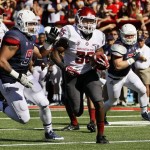  Washington State's Marcus Mason (35) runs pass Arizona's Sione Tuihalamaka (91) for a touchdown in the first half of an NCAA college football game, Saturday, Nov. 16, 2013 in Tucson, Ariz. (AP Photo/Wily Low)