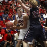 Arizona's Aaron Gordon (11) looks for an opening around Fairleigh Dickinson's Mathias Seilund (22) in the second half of an NCAA college basketball game, Monday, Nov. 18, 2013 in Tucson, Ariz. This is in the first round of the Preseason NIT. Arizona won 100 - 50. (AP Photo/Wily Low)