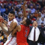 Ohio State's LaQuinton Ross, left, works against Arizona's Mark Lyons as Arizona coach Sean Miller gestures at rear during the first half of a West Regional semifinal in the NCAA men's college basketball tournament, Thursday, March 28, 2013, in Los Angeles. (AP Photo/Jae C. Hong)