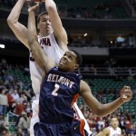Arizona's Kaleb Tarczewski, rear, pulls down a rebound over Belmont's Blake Jenkins (2) during the first half in a second-round game in the NCAA college basketball tournament in Salt Lake City Thursday, March 21, 2013. (AP Photo/Rick Bowmer)