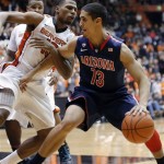 Arizona guard Nick Johnson, right, works the ball against Oregon State guard Langston Morris-Walker during the second half of an NCAA college basketball game in Corvallis, Ore., Saturday, Jan. 12, 2013. Johnson scored 14 points as Arizona defeated Oregon State 80-70. (AP Photo/Don Ryan)