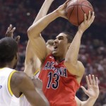 Arizona's Nick Johnson (13) goes up for a shot against UCLA in the first half during a semifinal Pac-12 tournament NCAA college basketball game, Friday, March 15, 2013, in Las Vegas. (AP Photo/Julie Jacobson)