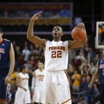 Southern California's Byron Wesley, center, reacts to a foul call on Arizona during the second half of an NCAA college basketball game in Los Angeles, Wednesday, Feb. 27, 2013. USC won 89-78. (AP Photo/Jae C. Hong)