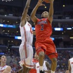 Arizona's Mark Lyons (2) drives to the basket against Ohio State's Sam Thompson during the first half of a West Regional semifinal in the NCAA mens' college basketball tournament, Thursday, March 28, 2013, in Los Angeles. (AP Photo/Mark J. Terrill)